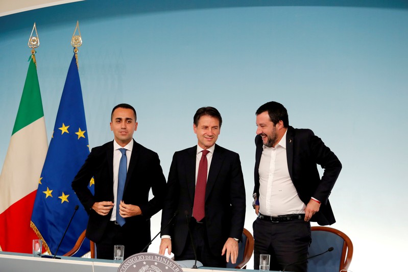 FILE PHOTO: Italy's Minister of Labor and Industry Luigi Di Maio, Prime Minister Giuseppe Conte and Interior Minister Matteo Salvini leave at the end of a news conference after a cabinet meeting at Chigi Palace in Rome