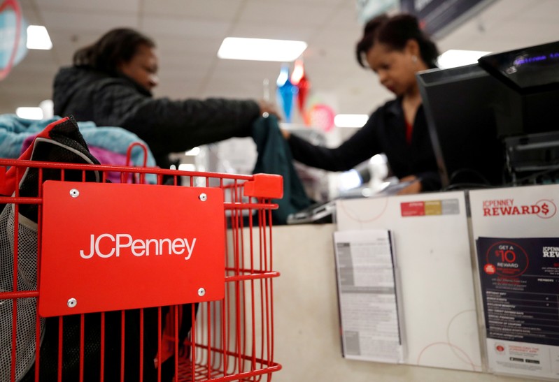 FILE PHOTO: A J.C. Penney employee helps a customer with her purchase at the J.C. Penney department store in North Riverside
