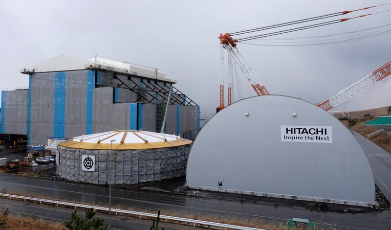 Hitachi logos are seen on Electric Power Development Co. Oma Nuclear Power Station under construction in Oma town