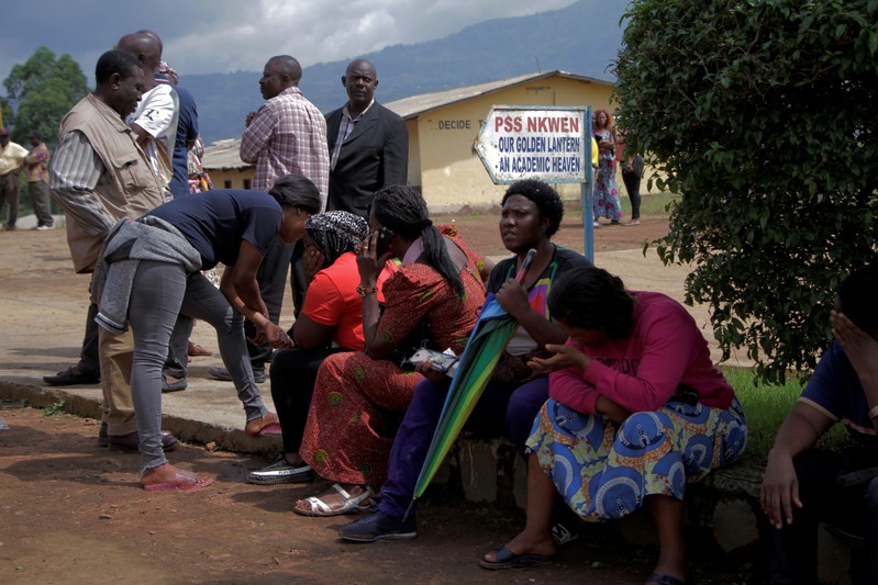 FILE PHOTO: Parents await for news of their children at a school where 79 pupils were kidnapped in Bamenda
