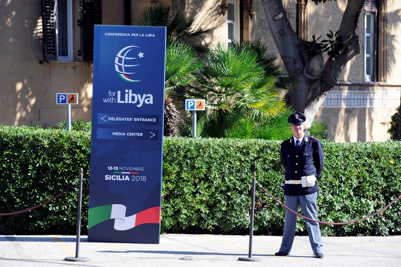 A policeman stands guard inside Villa Igiea the venue of the international conference on Libya in Palermo