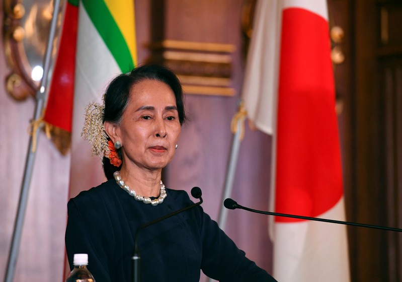 FILE PHOTO: Myanmar's State Counsellor Aung San Suu Kyi attends joint press remarks with Japan's Prime Minister Shinzo Abe (not in picture) after their bilateral meeting at the Akasaka Palace state guest house in Tokyo