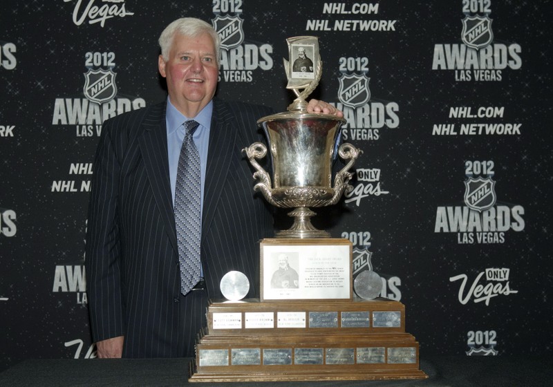 St. Louis Blues' Ken Hitchcock poses with the Jack Adams Award for coach of the year backstage during the 2012 NHL Awards show at the Wynn Las Vegas Resort in Las Vegas
