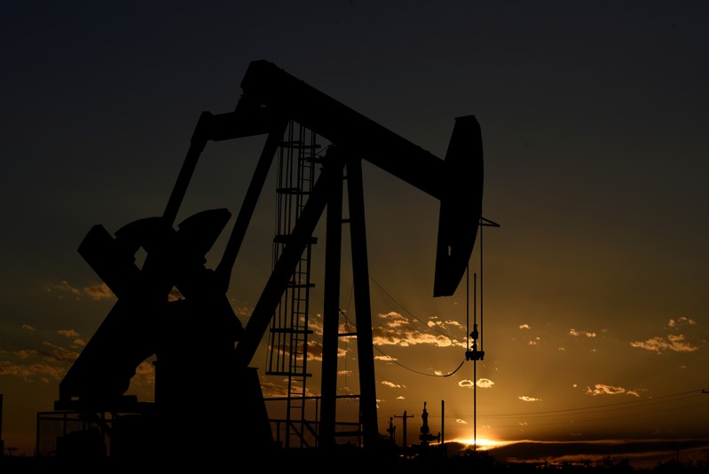 FILE PHOTO: A pump jack on a lease owned by Parsley Energy operates at sunset in the Permian Basin near Midland