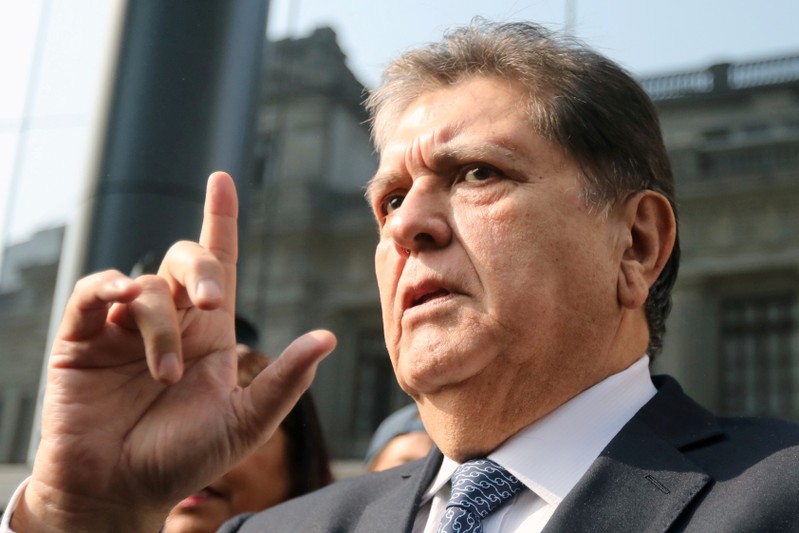 FILE PHOTO: Former Peruvian president Alan Garcia talks to the media as he arrives at the National Prosecution office in Lima