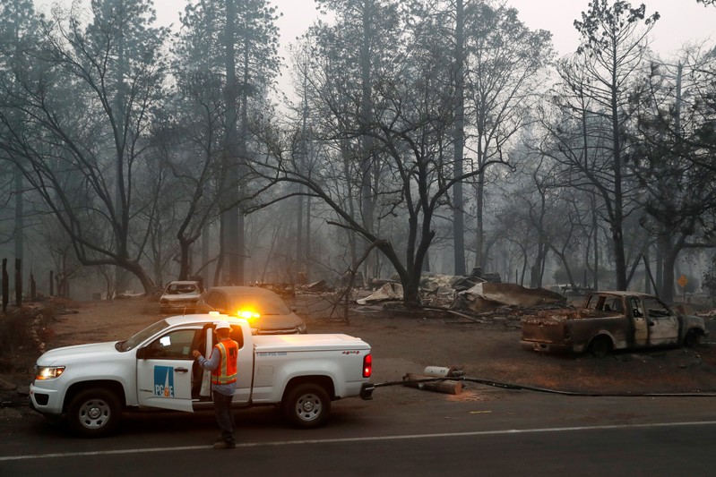 Employees of Pacific Gas & Electric work in the aftermath of the Camp Fire in Paradise