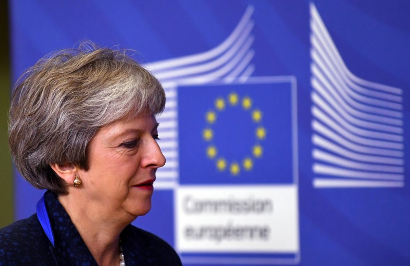 British PM May arrives at European Commission headquarters to discuss draft agreements on Brexit, in Brussels