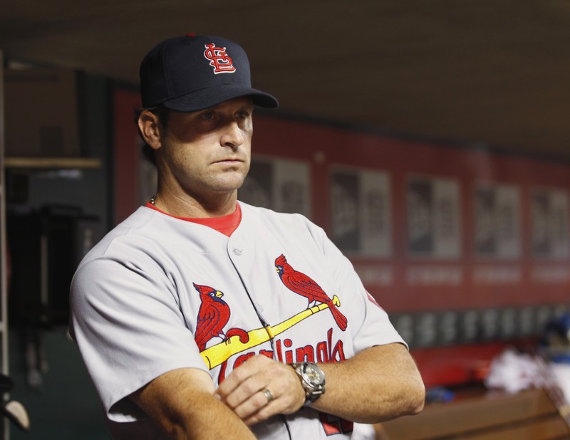 St Louis Cardinals manager Matheny watches team from dugout against Cincinnati Reds in MLB National League baseball game in Cincinnati