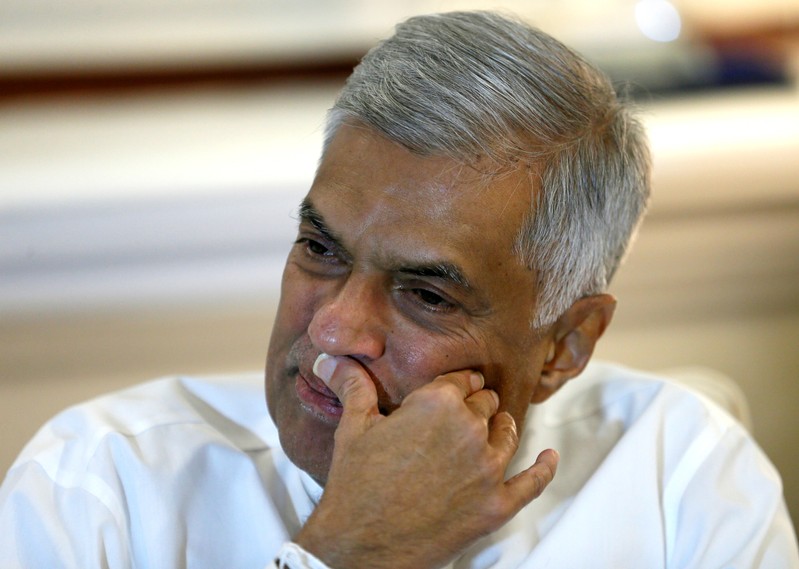 Sri Lanka's ousted Prime Minister Ranil Wickremesinghe gestures during an interview with Reuters at the Prime Minister's official residence in Colombo