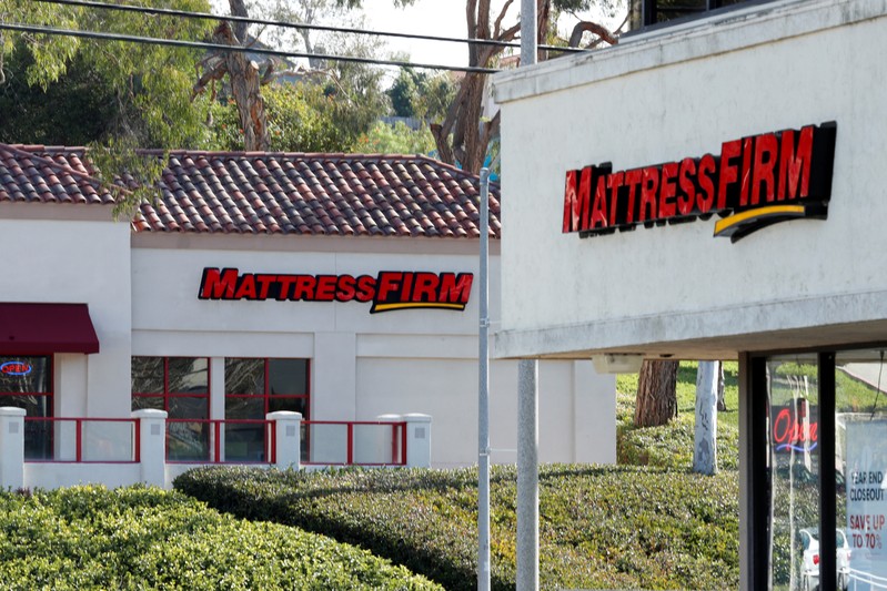 Two Mattress Firm stores lie on either side of the street in Encinitas, California,