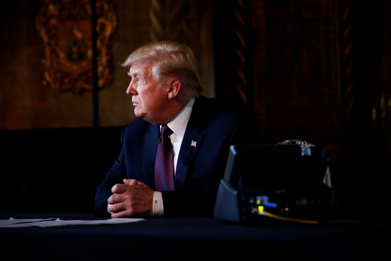 U.S. President Donald Trump takes questions from the media after speaking via teleconference with troops from Mar-a-Lago estate in Palm Beach
