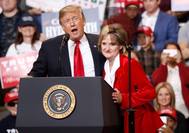 U.S. President Trump and Republican U.S. Senator Hyde-Smith speak to supporters during a Make America Great Again rally in Biloxi