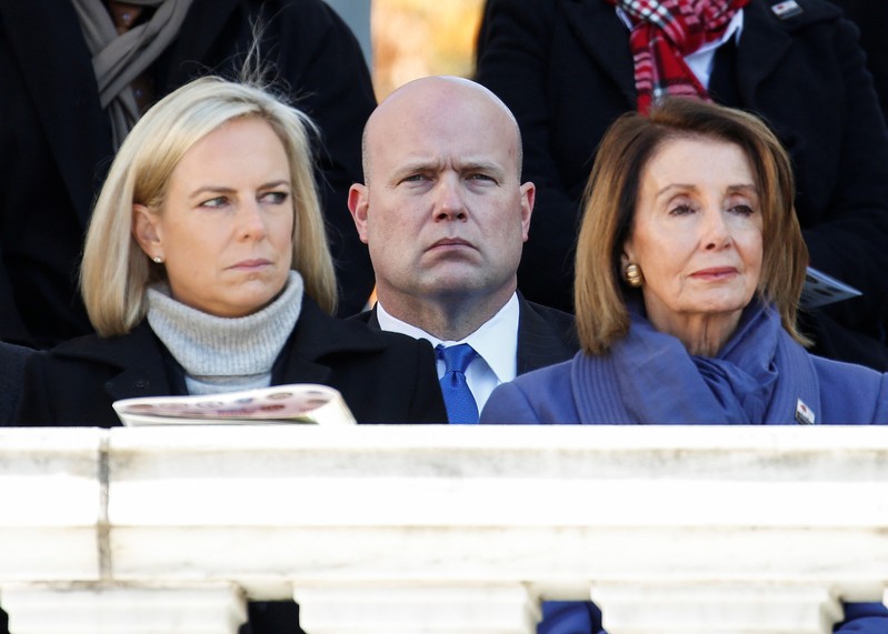 Acting U.S. Attorney General Matthew Whitaker, U.S. Secretary of Homeland Security Kirstjen Nielsen and House Minority Leader Nancy Pelosi (D-CA) sit during ceremonies on Veteran's Day at Arlington National Cemetery in Arlington