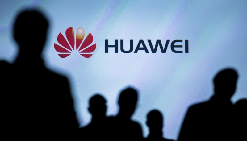 FILE PHOTO: Journalists follow the presentation of a Huawei smartphone ahead of the IFA Electronics show in Berlin