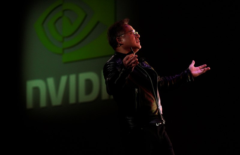 Jensen Huang, CEO of Nvidia, reacts to a video at his keynote address at CES in Las Vegas