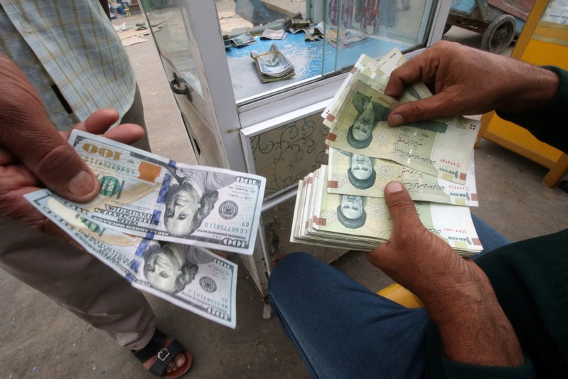 Iranian rials, U.S. dollars and Iraqi dinars are seen at a currency exchange shopÊin Basra