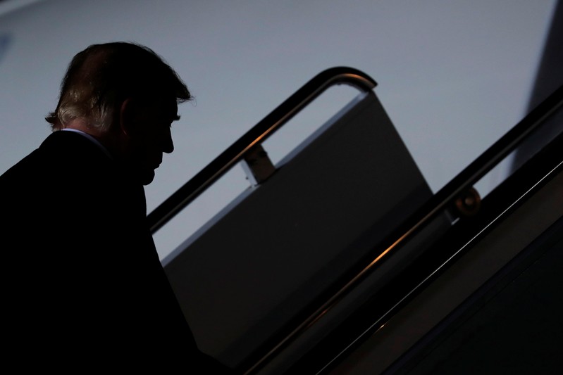 U.S. President Donald Trump boards Air Force One as he leaves a campaign rally at Columbia Regional Airport in Columbia, Missouri, U.S.