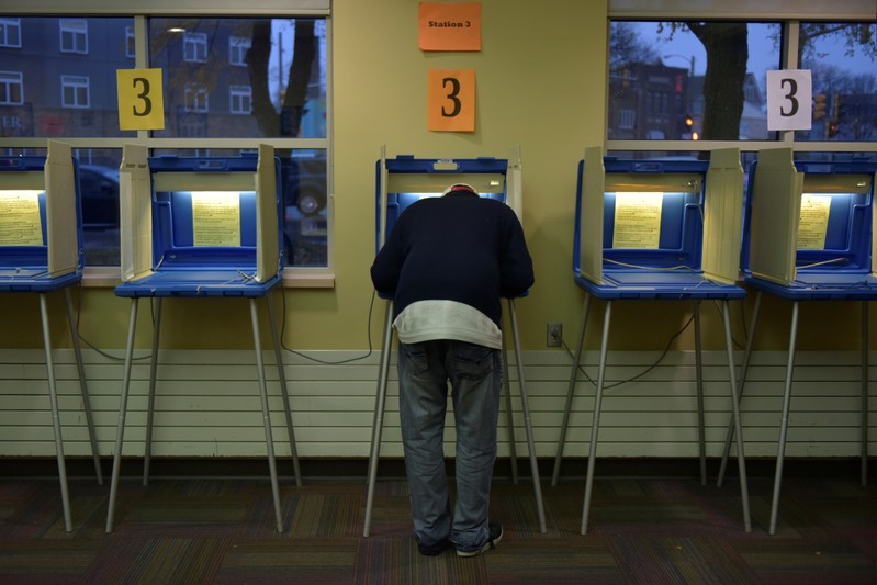 A voter fills out his ballot at an early voting station in Milwaukee, Wisconsin
