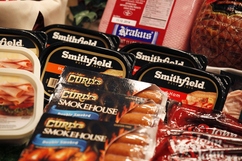 FILE PHOTO - Some of the products of Smithfield Foods are displayed at news conference in Hong Kong