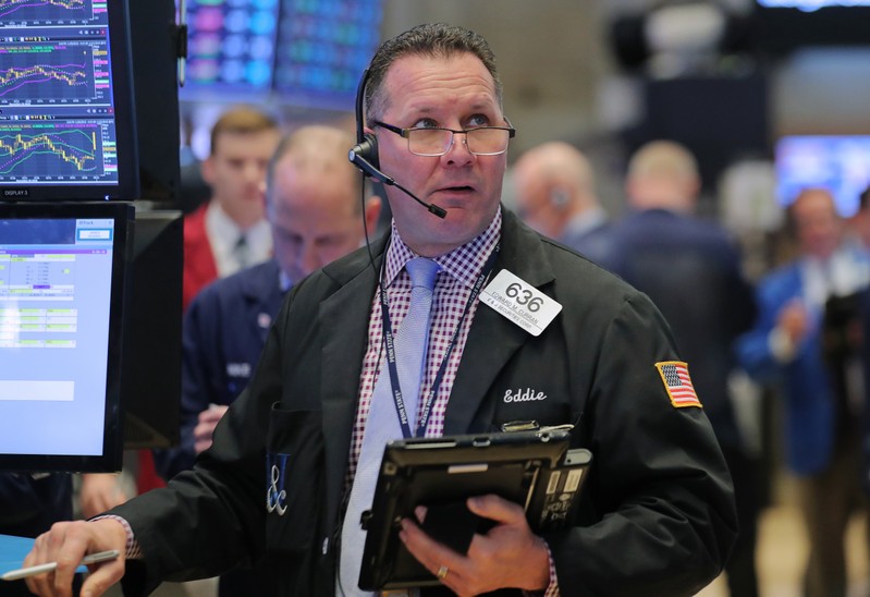 A trader works on the floor at the New York Stock Exchange (NYSE) in New York