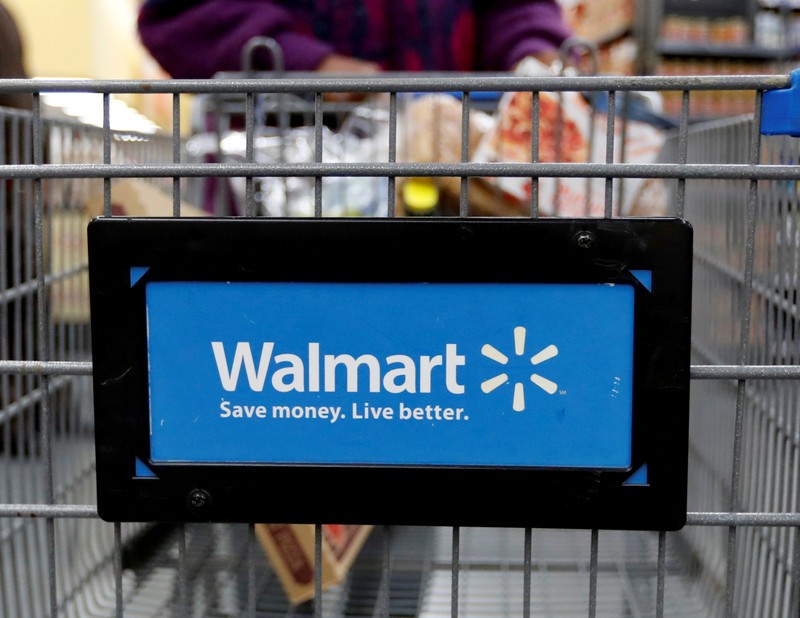 FILE PHOTO: A customer pushes a shopping cart at a Walmart store in Chicago