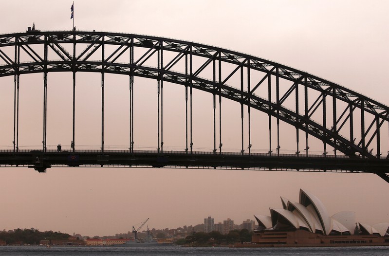 The Sydney Harbour Bridge and Sydney Opera House can be seen during a dust storm as it in descends upon the city of Sydney