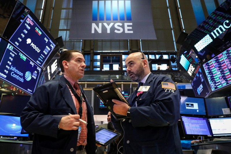 Traders work on the floor of the NYSE in New York