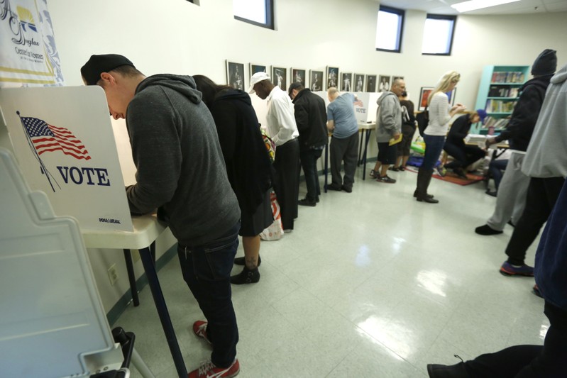 People vote during the 2016 presidential election at the Anne Douglas Center at the Los Angeles Mission in Los Angeles