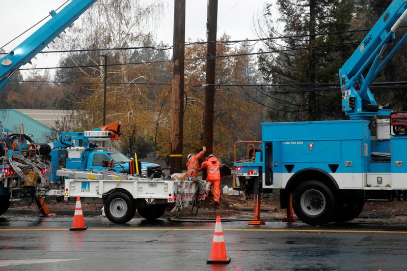 PG&E works on power lines to repair damage caused by the Camp Fire in Paradise