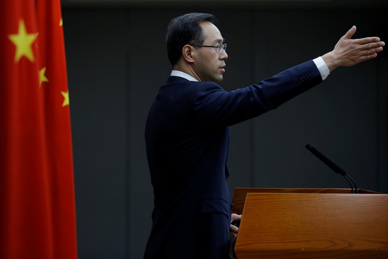 FILE PHOTO: China's Ministry of Commerce spokesperson Gao Feng attends a news conference in Beijing