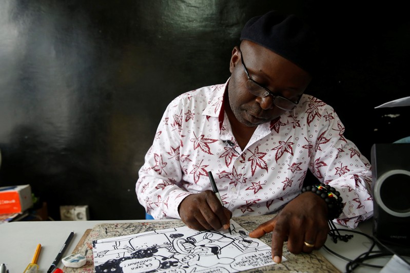 Thembo Kashauri, Democratic Republic of Congo's pre-eminent political cartoonist is seen during an interview with Reuters in Kinshasa
