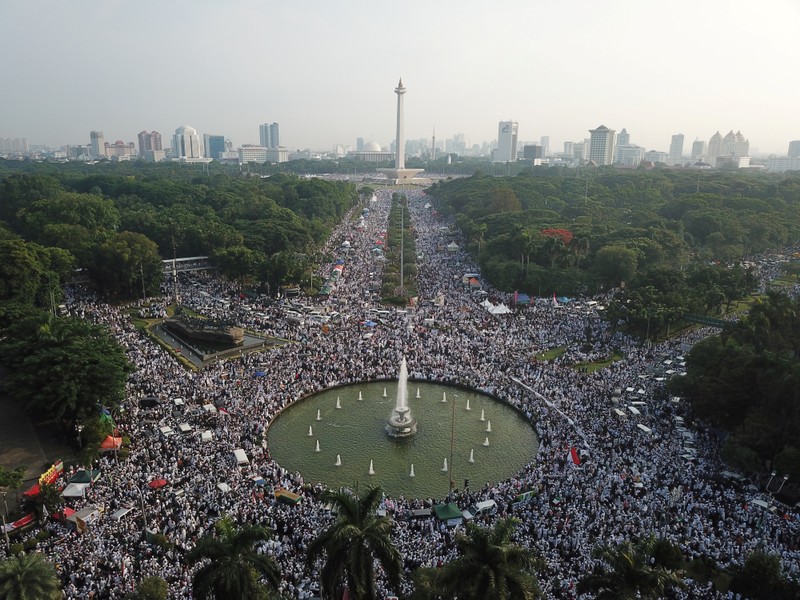 Tens of thousands of Indonesian Muslims attend a rally to commemorate a series of rallies starting in late 2016 in Jakarta
