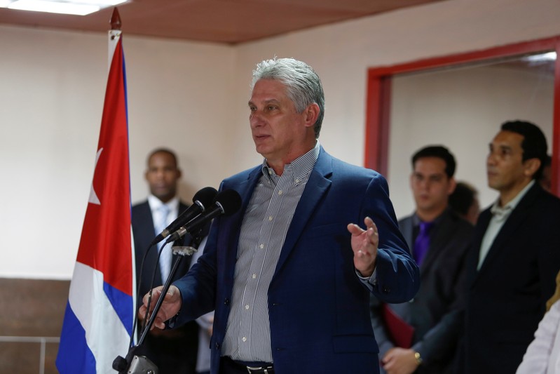 Cuba's President Miguel Diaz-Canel speaks during a welcoming ceremony to Cuban doctors just arrived from Brazil at the Jose Marti International Airport in Havana