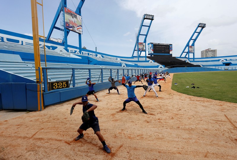 FILE PHOTO: Players of the Industriales team practice at the Latinoamericano stadium in Havana