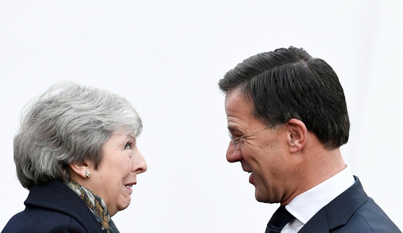 FILE PHOTO: British PM May is welcomed by Dutch PM Rutte