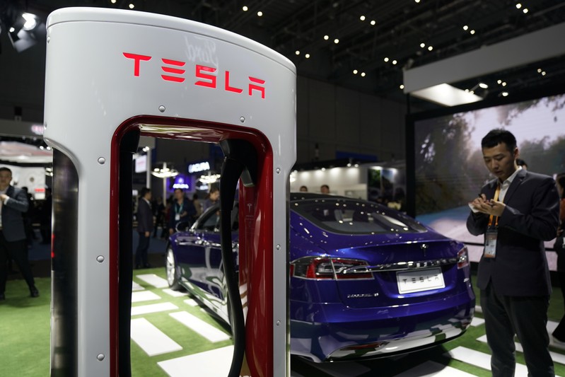 FILE PHOTO - A Tesla sign is seen during the China International Import Expo (CIIE), at the National Exhibition and Convention Center in Shanghai