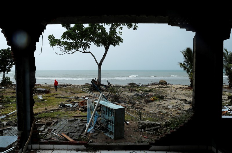 Debris is seen along a beach after a tsunami, near Sumur, Banten province