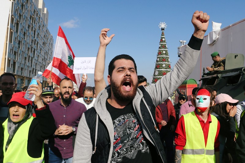A man gestures as he takes part in a protest over the Lebanon's economy and politics in Beirut