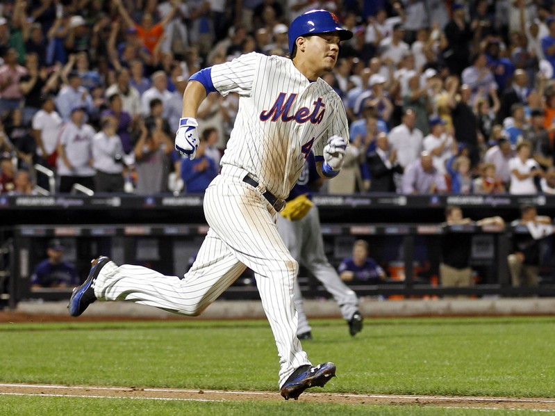 FILE PHOTO: Mets' Flores runs up the first baseline after hitting a 3-RBI double against the Rockies during the eighth inning of their MLB National League baseball game at CitiField in New York
