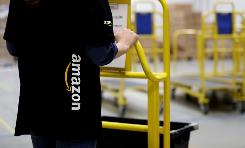 FILE PHOTO: An employee works at the Amazon fulfillment center in the village of Dobroviz, near Prague