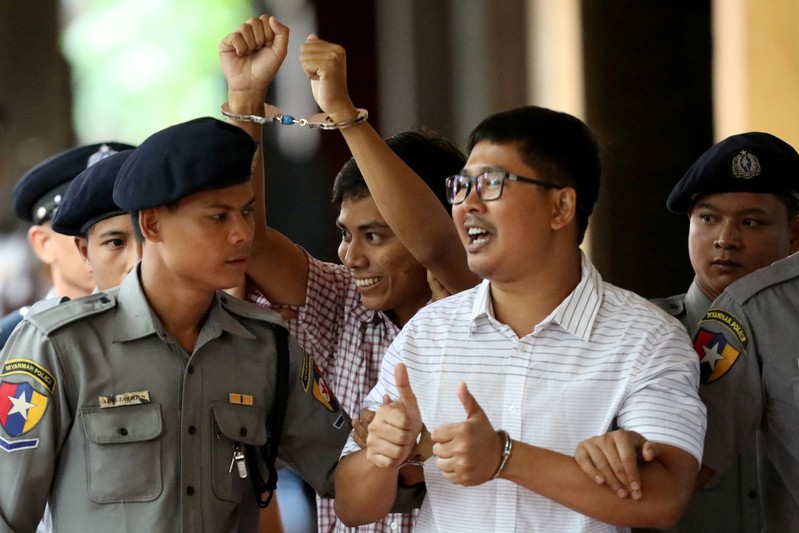 FILE PHOTO: Detained Reuters journalist Wa Lone and Kyaw Soe Oo arrive at Insein court in Yangon