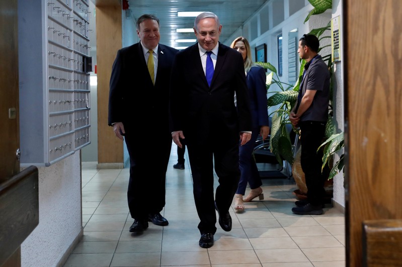 FILE PHOTO - Israeli Prime Minister Benjamin Netanyahu and U.S. Secretary of State Mike Pompeo arrive for a news conference at the Ministry of Defence in Tel Aviv