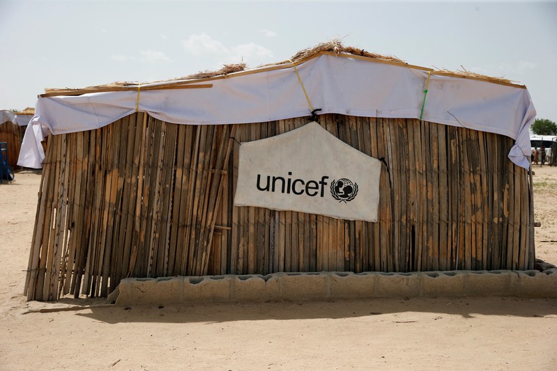 FILE PHOTO: UNICEF logo banner is seen hanging on a makeshift school at IDP camp on the outskirts of Maiduguri