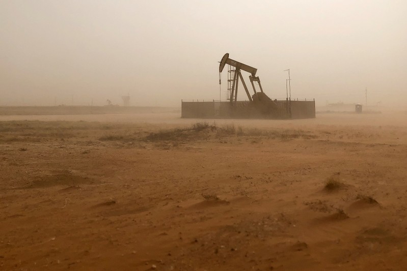 Pump jack lifts oil out of well during sandstorm in Midland