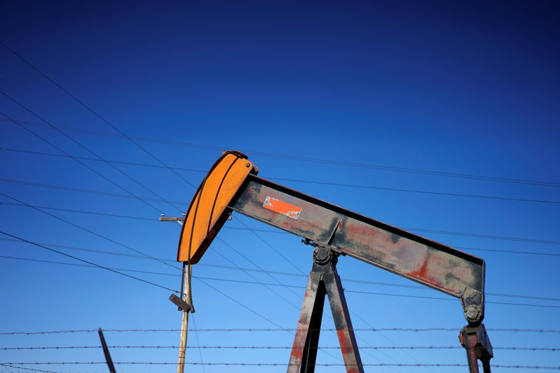 An oil well pump jack is seen at an oil field supply yard near Denver