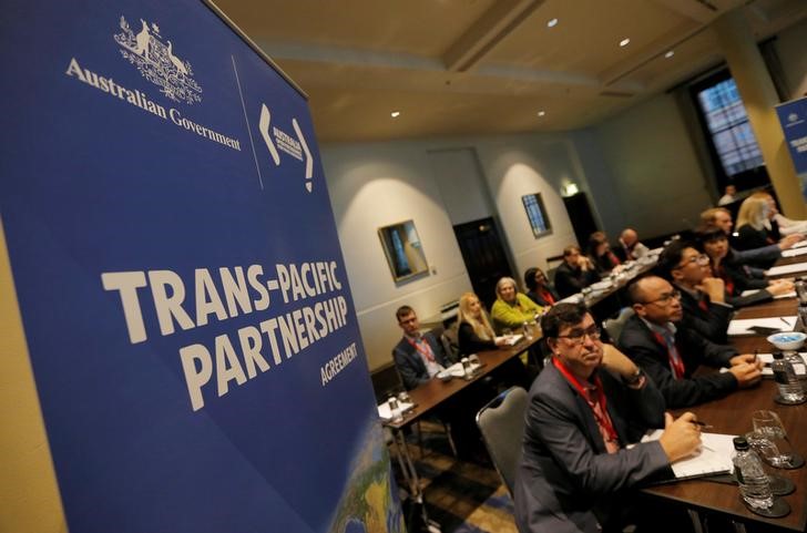 FILE PHOTO - Delegates participate in the opening session of the Trans Pacific Partnership senior leaders meeting in Sydney
