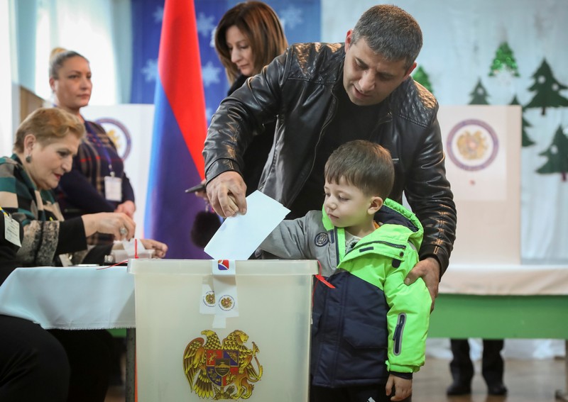 A man votes during an early parliamentary election in Yerevan