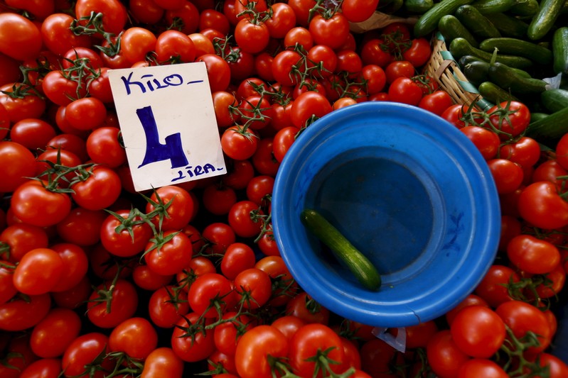 A card showing the price of tomatoes is seen at a bazaar in Istanbul