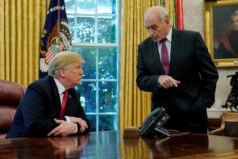 FILE PHOTO: U.S. President Trump speaks to Chief of Staff Kelly at the White House in Washington