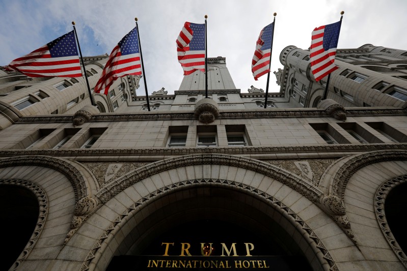 FILE PHOTO: U.S. flags fly over the Trump International Hotel in Washington